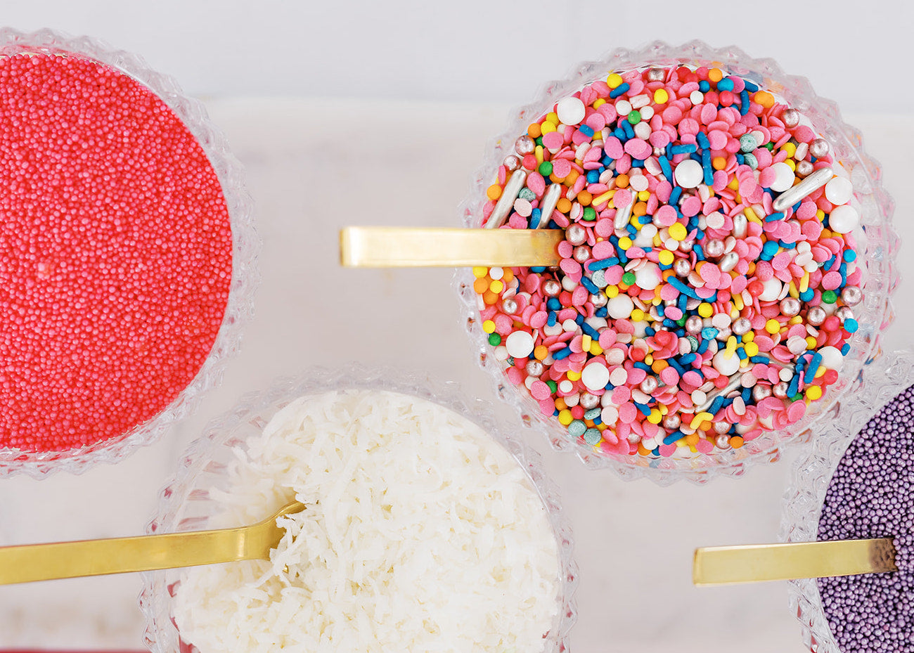 Custom colorful sprinkles and toppings at wedding cupcake bar in Austin Texas