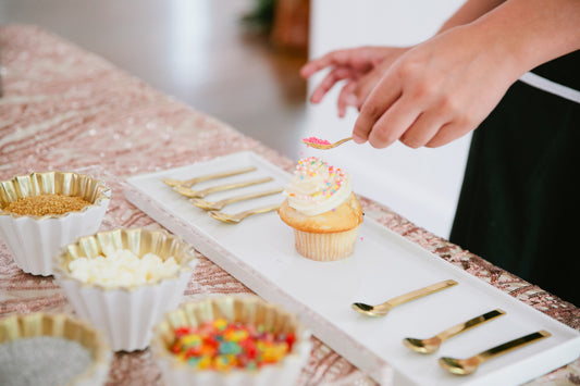 Cupcake bartender designing a cupcake as a creative wedding cake alternative