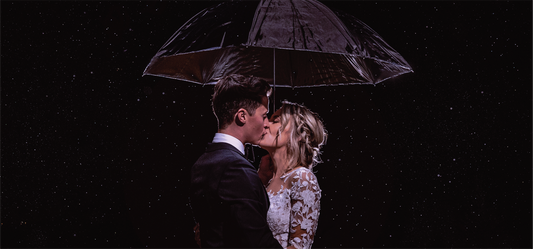 Austin Bride and Groom Kiss on Wedding Day Under Rain Umbrella